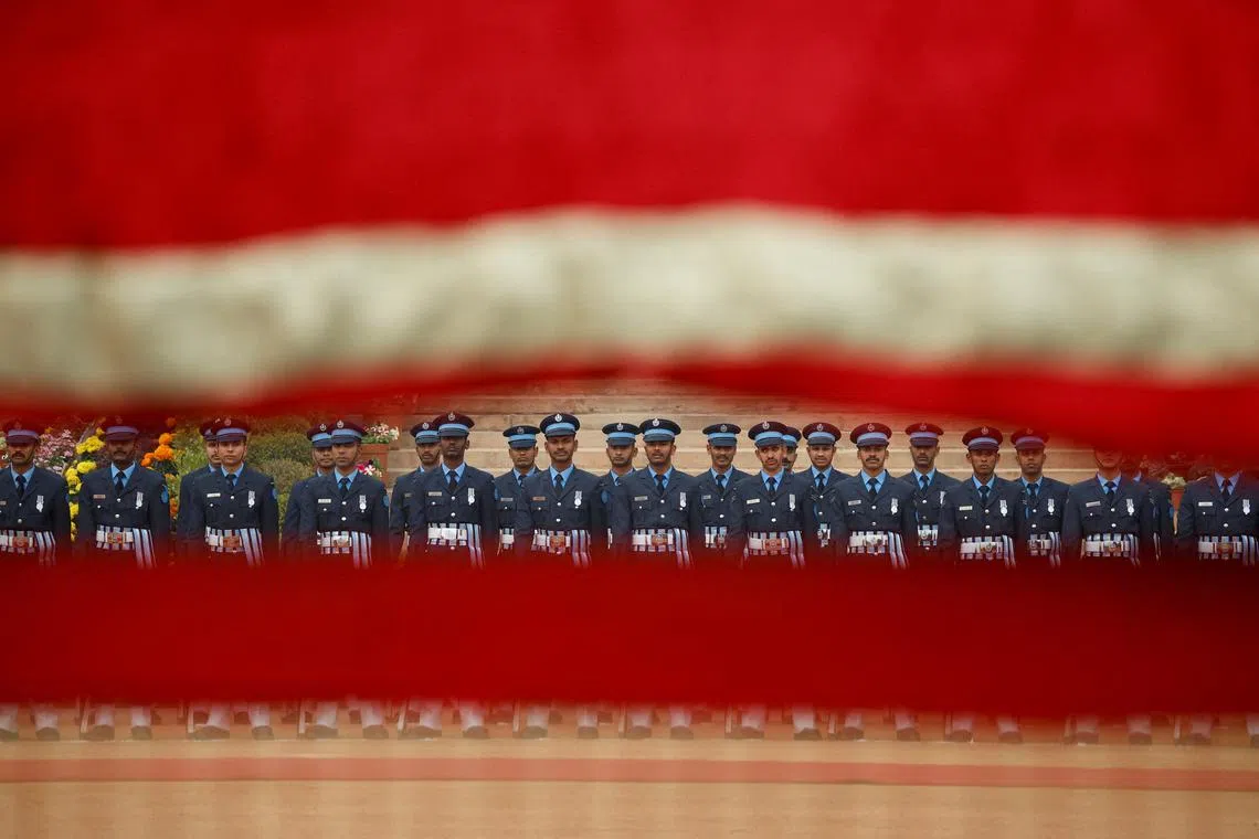Indian soldiers standing at attention on the day of the Emir of Qatar Sheikh Tamim bin Hamad Al Thani's ceremonial reception, at the forecourt of India's Rashtrapati Bhavan in New Delhi, India, Feb 18, 2025.