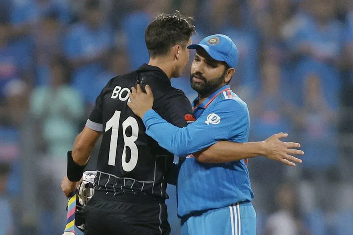 Cricket - ICC Cricket World Cup 2023 - Semi-Final - India v New Zealand - Wankhede Stadium, Mumbai, India - November 15, 2023 India's Rohit Sharma shakes hands with New Zealand's Trent Boult after the match REUTERS/Francis Mascarenhas