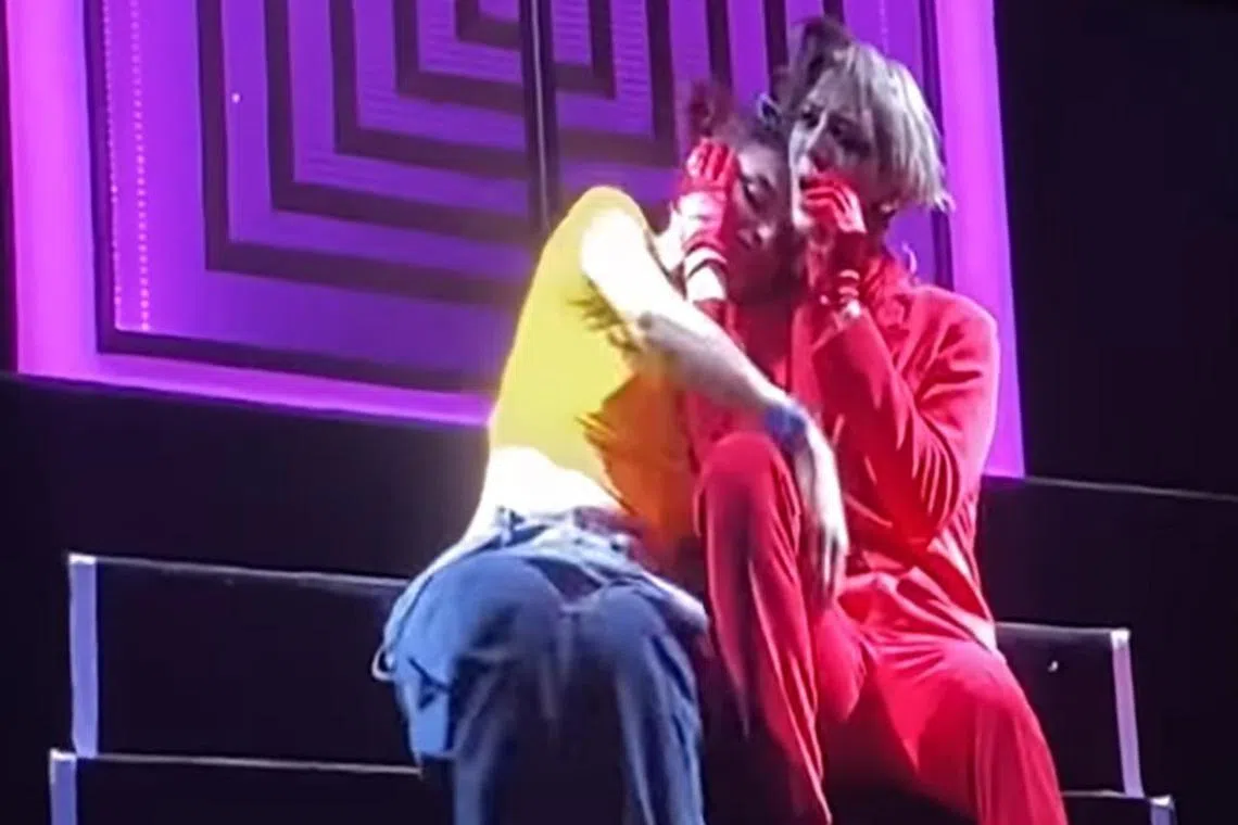 An overly enthusiastic fan was captured on video with her hands all over singer Jackson Wang.