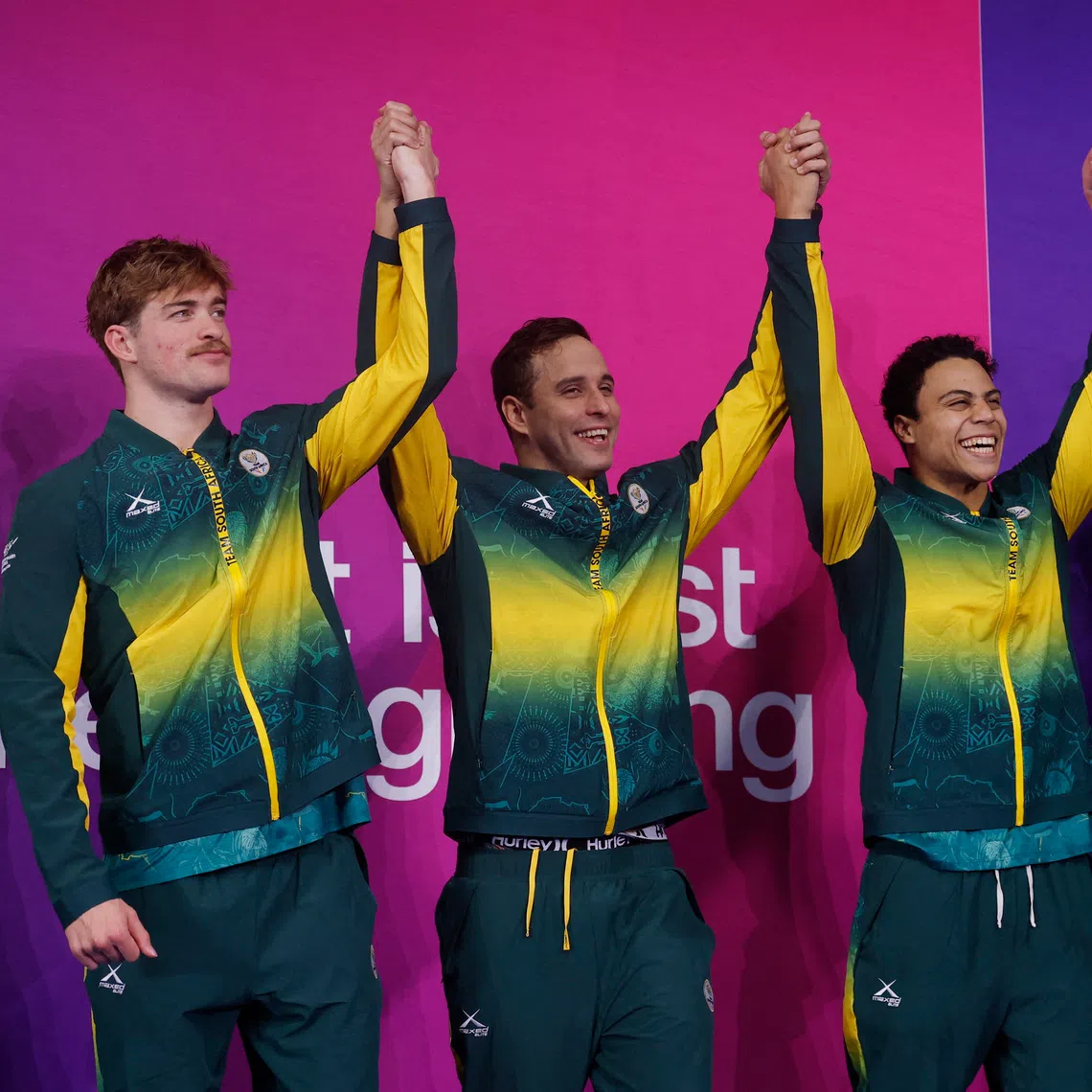 Bronze medallists South Africa’s Pieter Coetze, Michael Houlie, Chad le Clos and Ruard van Renen celebrate on the podium after the men’s 4 x 100m medley relay final.