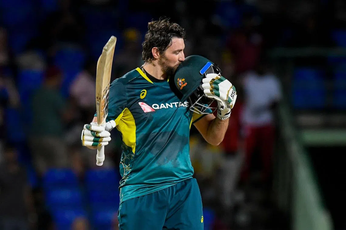 Australia's Tim David celebrates his century in the third T20 international against West Indies at Warner Park Sporting Complex in Basseterre, Saint Kitts and Nevis, on July 25, 2025.
