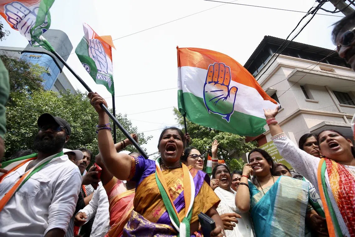 Supporters of the Congress Party celebrate their victory in the southern city of Bangalore, India, on May 13, 2023.