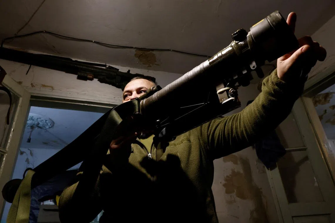 "Kamin", of the 10th Mountain Assault Brigade, explains how to fire a Stinger portable anti-aircraft missile, near Soledar north of Bakhmut, on March 23, 2023.
