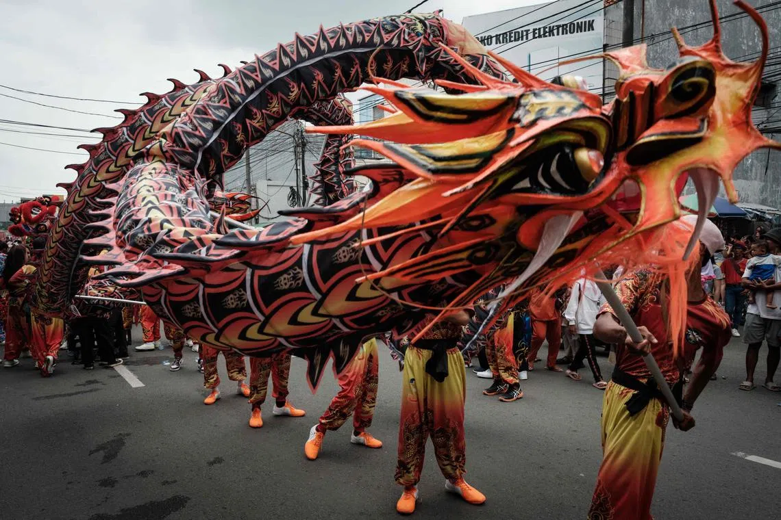 Performers of the dragon dance rehearsing during the Cap Go Meh festival, marking the last day of the Lunar New Year of the Dragon when the full moon is at its brightest on the 15th night of the first month, at the Guan Yu temple in Karawang, West Java, on Feb 25, 2024