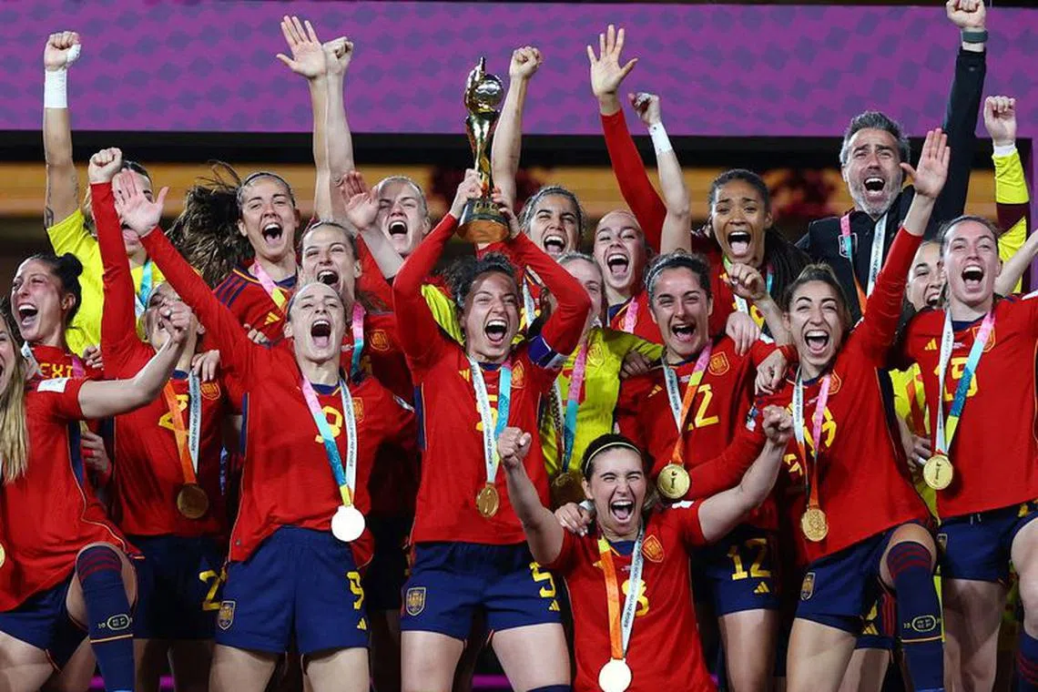 FILE PHOTO: Soccer Football - FIFA Women's World Cup Australia and New Zealand 2023 - Final - Spain v England - Stadium Australia, Sydney, Australia - August 20, 2023 Spain players celebrate with the trophy after winning the world cup REUTERS/Hannah Mckay/File Photo