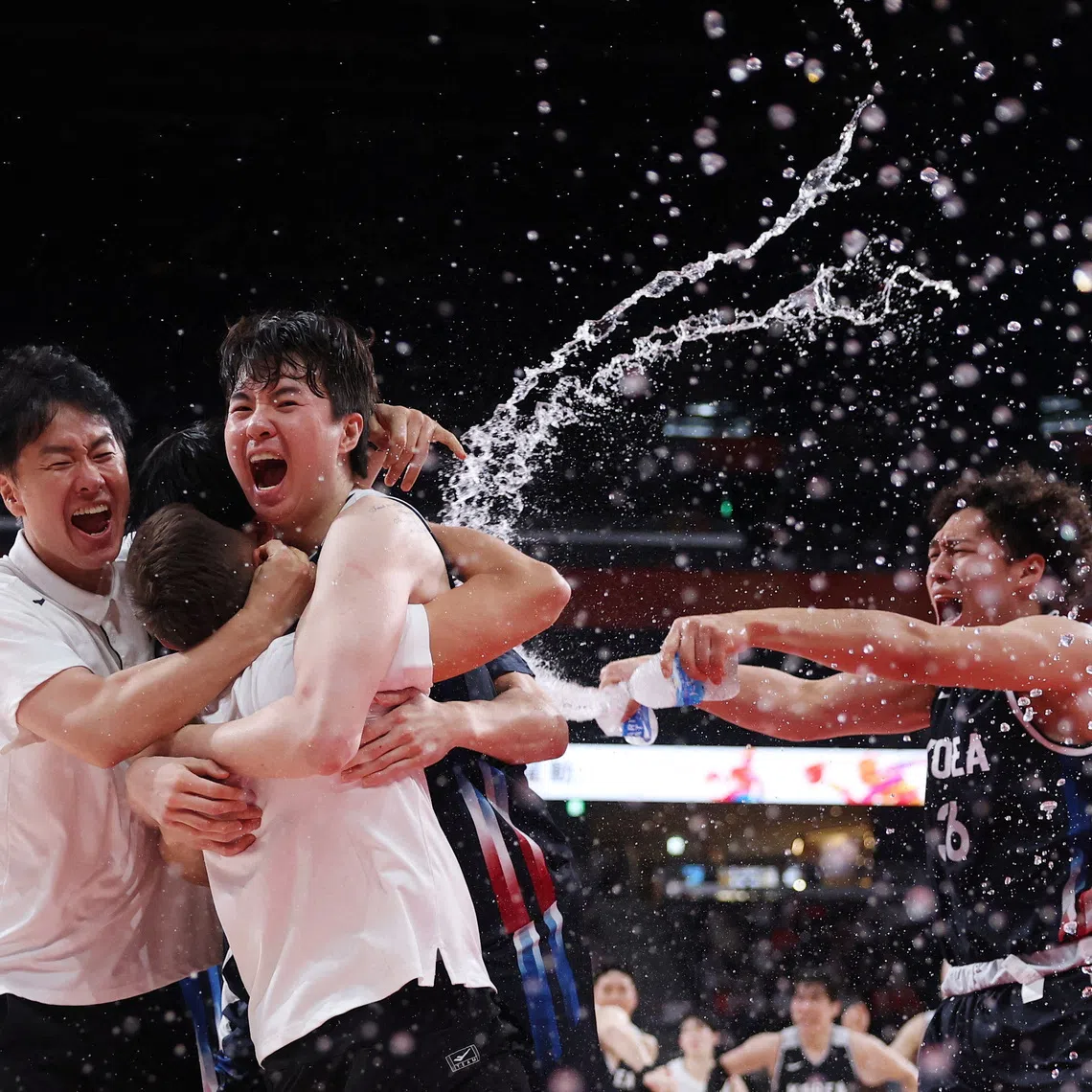 South Korea team members celebrate after winning gold at the Asian Games.