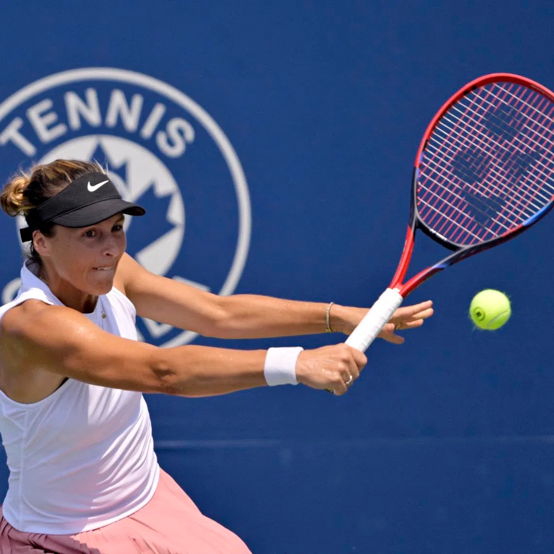 Jul 28, 2025; Montreal, QC, Canada; Tatjana Maria (GER) reacts returns the ball against Laura Siegemund (GER) in first round play at IGA Stadium. Mandatory Credit: Eric Bolte-Imagn Images