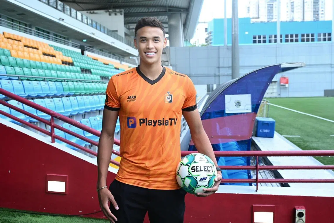 Singapore striker Ilhan Fandi donning the jersey of Belgian second-tier club KMSK Deinze during a press conference at the Jalan Besar Stadium on Dec 13, 2022.