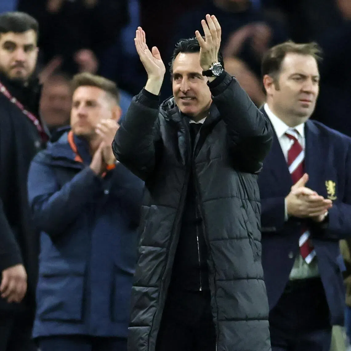 Aston Villa manager Unai Emery applauds fans on the pitch after the English Premier League match against Liverpool at Villa Park.
