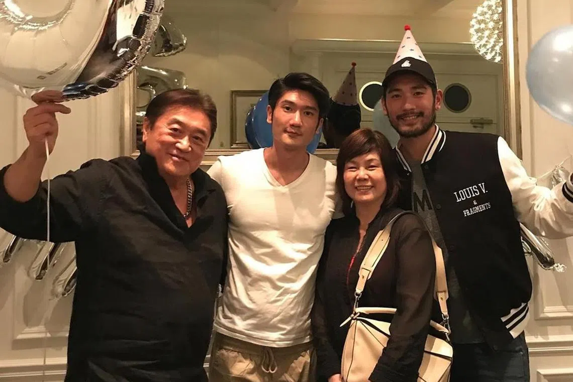 Model Charles Gao with his parents and late brother Godfrey (far right).