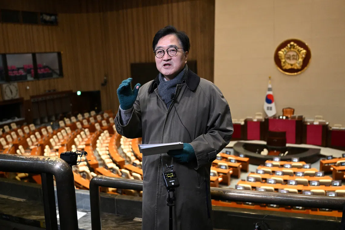 National Assembly Speaker Woo Won-shik guides visitors during a dark tour on martial law sites to mark the first anniversary of the declaration of martial law by ousted president Yoon Suk Yeol, at the National Assembly in Seoul, South Korea, December 3, 2025.  Jung Yeon-Je/Pool via REUTERS
