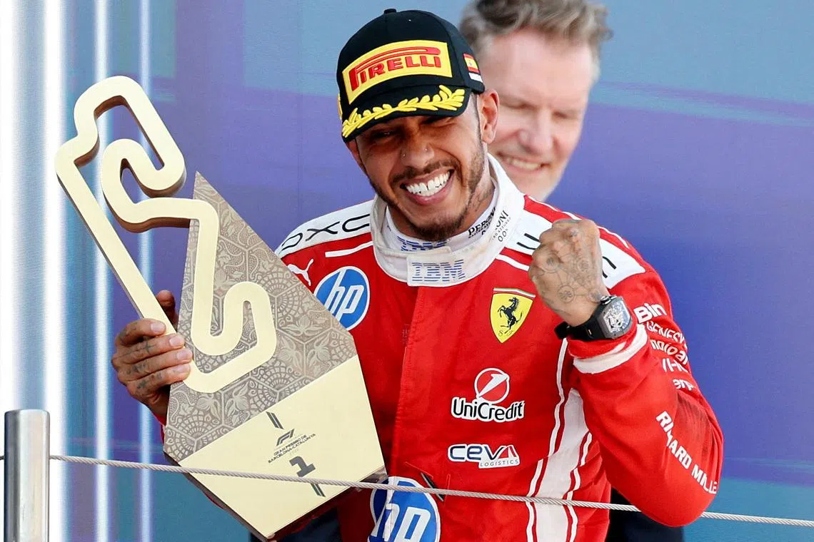 Formula One F1 - Barcelona-Catalunya Grand Prix - Circuit de Barcelona-Catalunya, Barcelona, Spain - June 14, 2026 Ferrari's Lewis Hamilton celebrates with the trophy after winning the Barcelona-Catalunya Grand Prix REUTERS/Nacho Doce