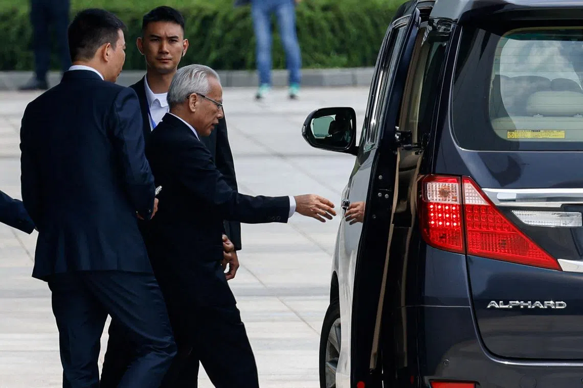 Former president of Macau's Court of Final Appeal, Sam Hou-fai, walks towards a vehicle after a press conference to announce his candidacy for Macau's sixth-term Chief Executive election, in Macau, China, August 28, 2024. REUTERS/Tyrone Siu
