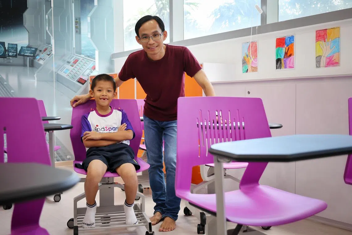 Mr Lin Quanhong and his son Lin Sheng, a Mindchamps scholarship recipient.