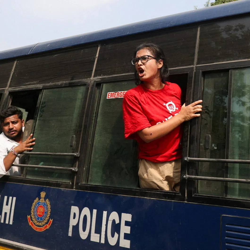 Neha Bora, National President of the All India Students' Association (AISA), shouts from a police vehicle after being detained during a protest organised by the Cockroach Janta Party (CJP) seeking the resignation of India's Chief Election Commissioner, Gyanesh Kumar, in New Delhi, India, October 10, 2026. REUTERS/Stringer