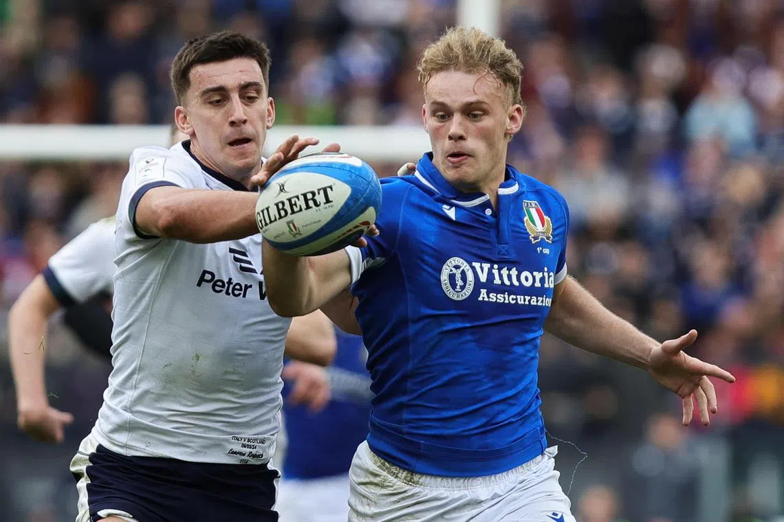 epa11209237 Cameron Redpath (L) of Scotland and Louis Lynagh of Italy in action during the Six Nations rugby match between Italy and Scotland in Rome, Italy, 09 March 2024.  EPA-EFE/FEDERICO PROIETTI