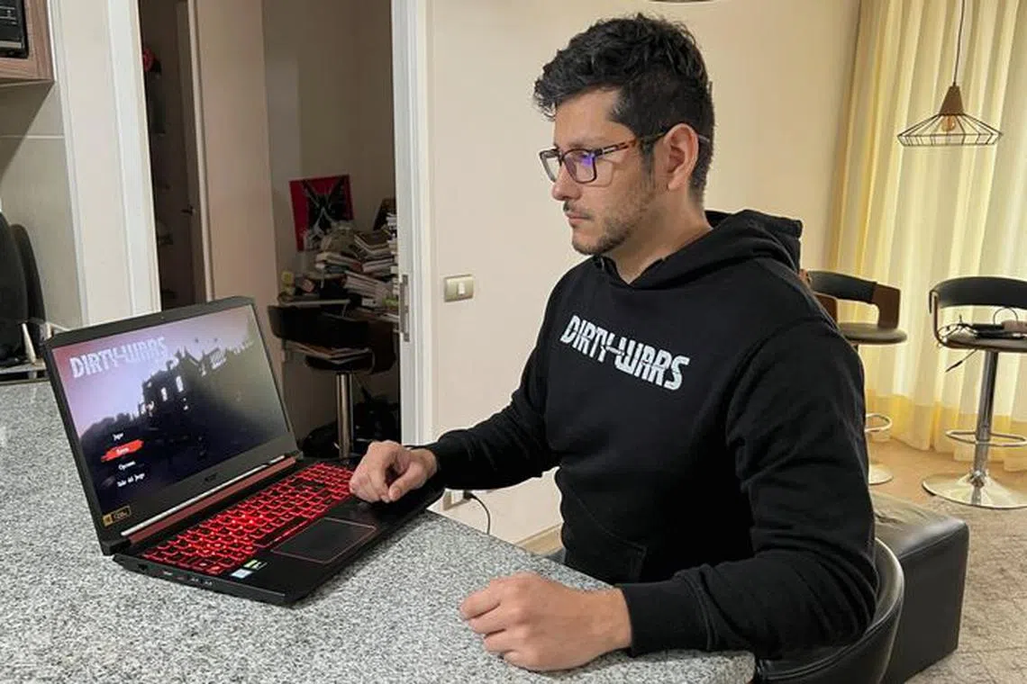 'Dirty Wars' videogame recreator, Jorge Olivares, inspired by Chile's military coup and the fight against Pinochet's dictatorship, shows a screen with his game featuring La Moneda government palace, in Santiago, Chile, September 4, 2023. REUTERS/Rodrigo Gutierrez