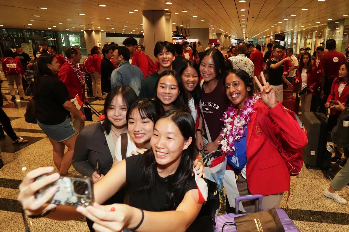Singapore sprint queen Shanti Pereira posing for a wefie with fans after arriving at Changi Airport on Saturday.