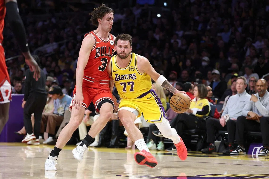 LOS ANGELES, CALIFORNIA - MARCH 12: 


Luka Doncic #77 of the Los Angeles Lakers dribbles into the defense of Josh Giddey #3 of the Chicago Bulls during the first half of a game at Crypto.com Arena on March 12, 2026 in Los Angeles, California.   Sean M. Haffey/Getty Images/AFP (Photo by Sean M. Haffey / GETTY IMAGES NORTH AMERICA / Getty Images via AFP)