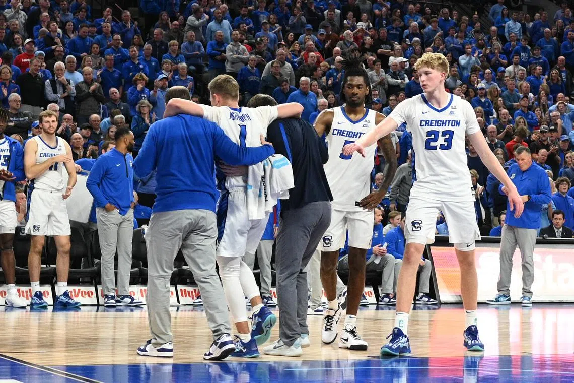 FILE PHOTO: Nov 22, 2024; Omaha, Nebraska, USA; Creighton Bluejays guard Steven Ashworth (1) is helped off the court against the Nebraska Cornhuskers during the second half at CHI Health Center Omaha. Steven Branscombe-Imagn Images/File Photo