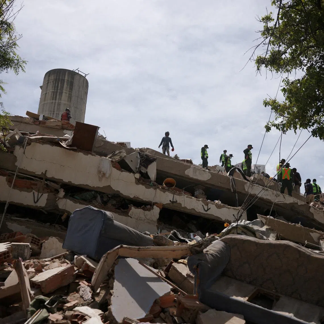 Rescue team members search for casualties among rubble after earthquakes hit the country, in Tanaguarena neighborhood, La Guaira, Venezuela, June 28, 2026. REUTERS/Leonardo Fernandez Viloria