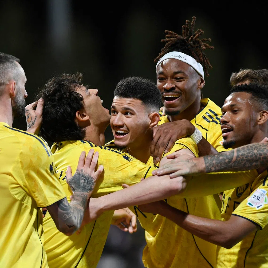 Soccer Football - Saudi Pro League - Al Fayha v Al Nassr - Al-Majma'ah Sports City Stadium, Al Majma'ah, Saudi Arabia - February 28, 2026 Al Nassr's Abdullah Al-Hamdan celebrates scoring their third goal with Joao Felix, Marcelo Brozovic, and teammates REUTERS/Stringer