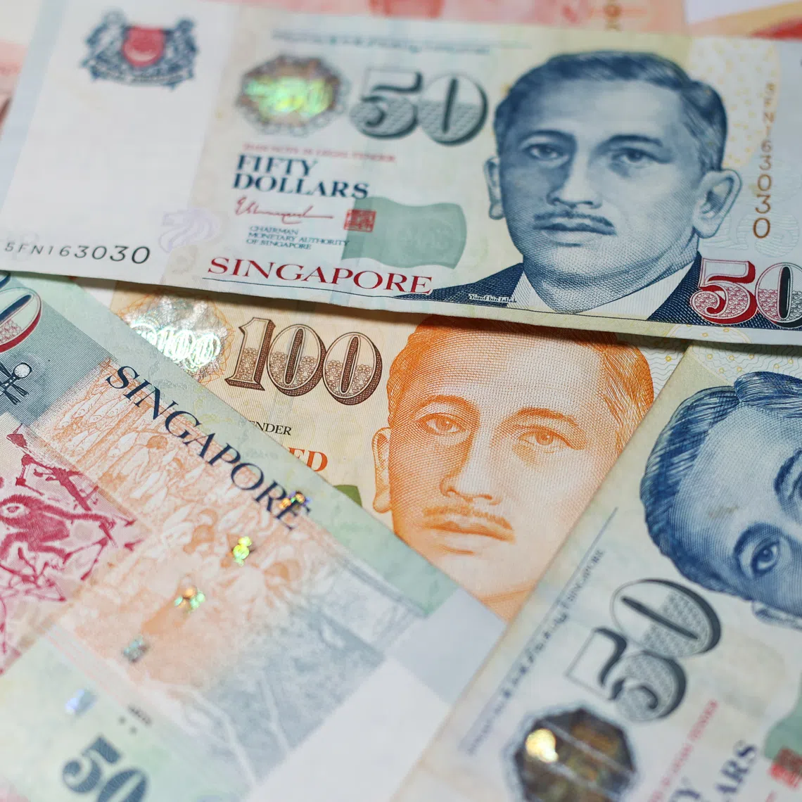 The Singapore dollar is tracking the US currency in an inverse direction more closely than any other in Asia.