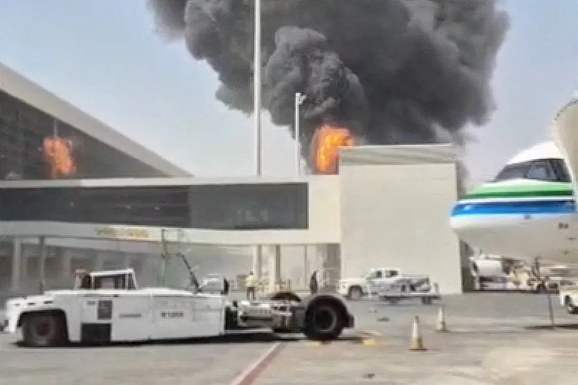 Smoke and flames rising from King Khalid Airport, after Yemen’s Iran-backed Houthis attacked the airport in Riyadh on Oct 8.