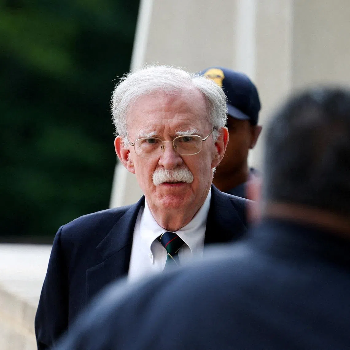 Former White House national security adviser John Bolton arrives at the US District Court for the District of Maryland on June 26.