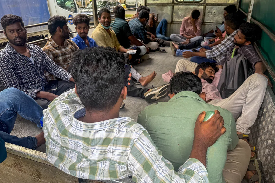 Workers from KPA Engineering in a lorry near the Ministry of Manpower Services Centre in Bendemeer on June 23.