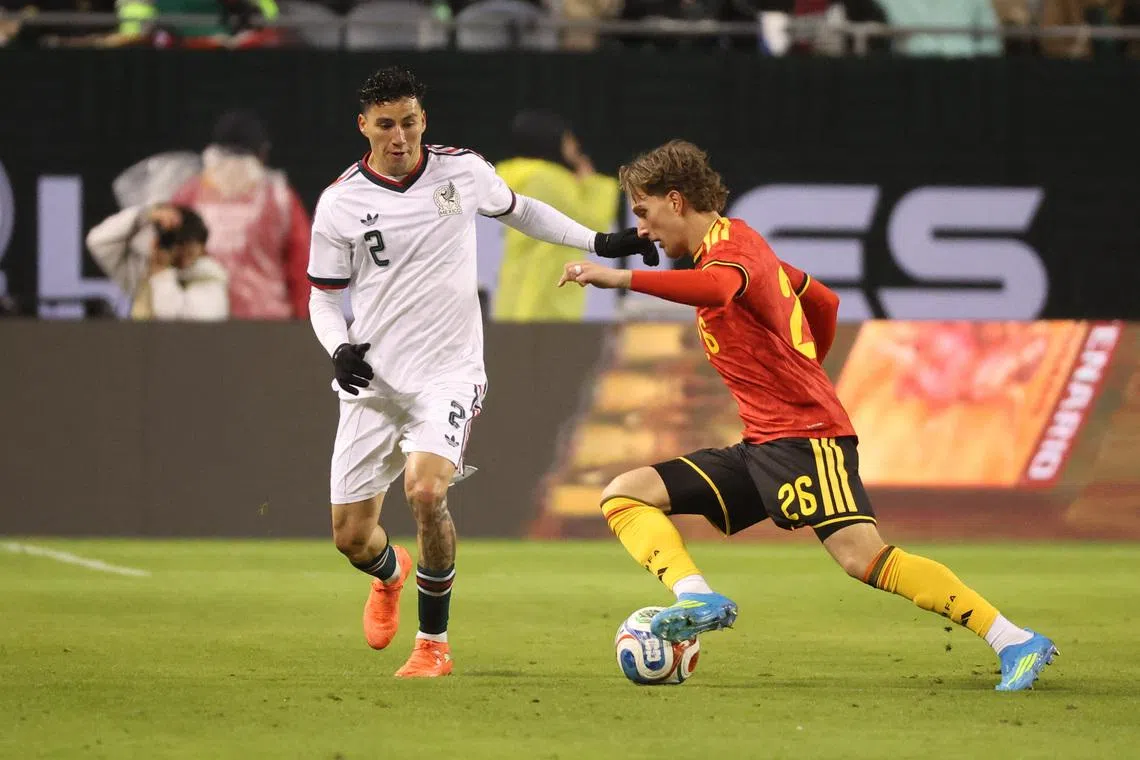Mar 31, 2026; Chicago, IL, USA; Mexico defender Jorge Sanchez (2) and Belgium forward Mika Godts (26) battle for control of the ball during the first half at Soldier Field. Mandatory Credit: Talia Sprague-Imagn Images