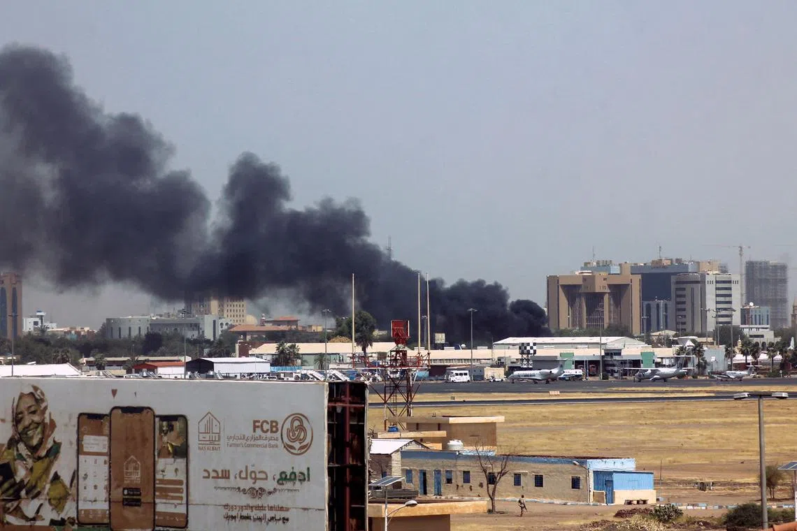 Heavy smoke bellows above buildings in the vicinity of the Khartoum's airport on April 15, 2023, amid clashes in the Sudanese capital. 