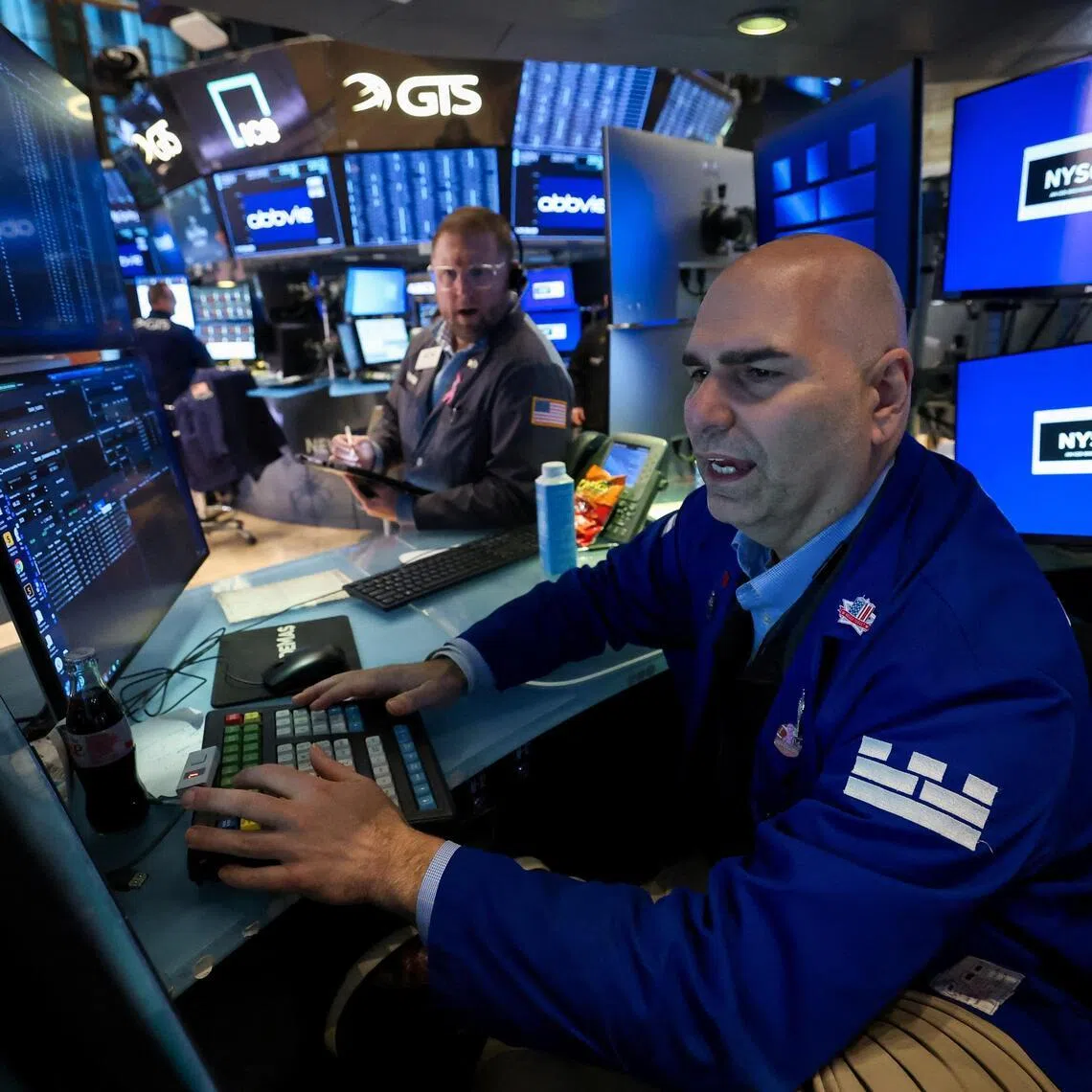 Traders working on the floor of the New York Stock Exchange, in New York City, on Jan 13.