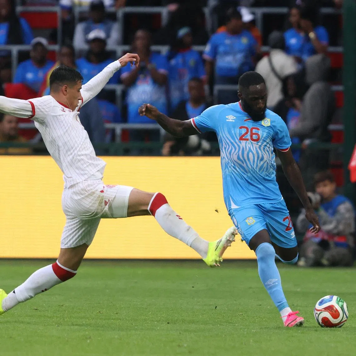 Soccer Football - International Friendly - Democratic Republic of Congo v Denmark - Stade Maurice Dufrasne, Liege, Belgium - June 3, 2026 Democratic Republic of Congo's Arthur Masuaku in action with Denmark's Adam Daghim REUTERS/Nicolas Economou