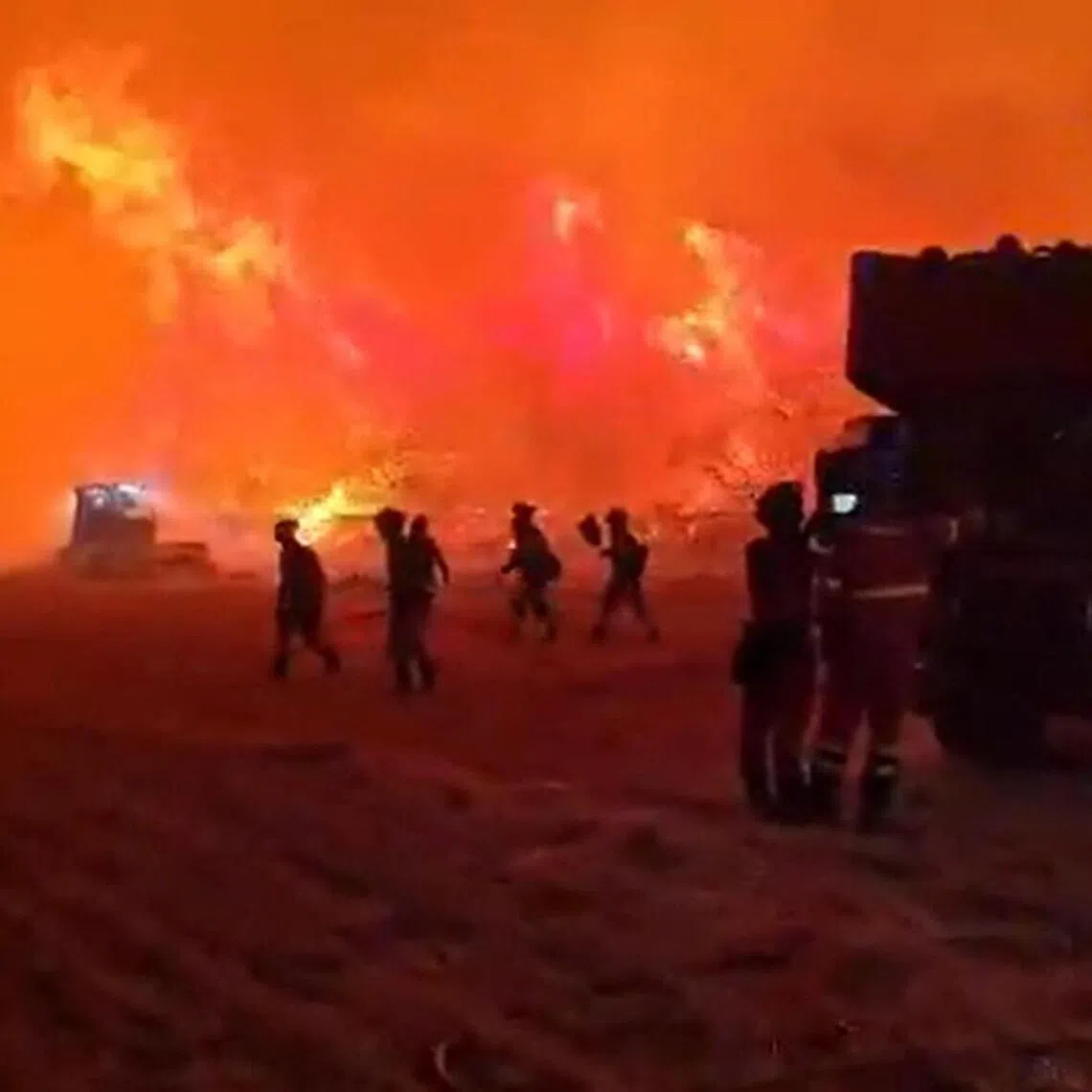 This screen grab taken from handout video footage released on July 17, 2026 by Spain's Military Emergencies Unit (UME) shows the military unit fighting a massive wildfire through the night in a sparsely populated part of the Aragon region in the country's northeast, after the blaze doubled in size overnight to scorch over 12,000 hectares. (Photo by Handout / UME / AFP) / RESTRICTED TO EDITORIAL USE - MANDATORY CREDIT "AFP PHOTO /  SPAIN'S MILITARY EMERGENCIES UNIT (UME) / HANDOUT /  " - NO MARKETING NO ADVERTISING CAMPAIGNS - DISTRIBUTED AS A SERVICE TO CLIENTS