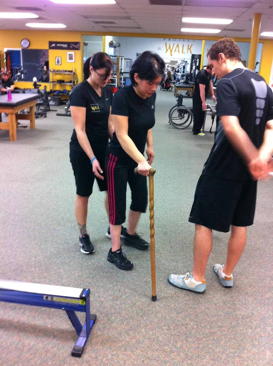 Ong in 2010 with trainers at Project Walk, a rehabilitation programme in San Diego in the US.