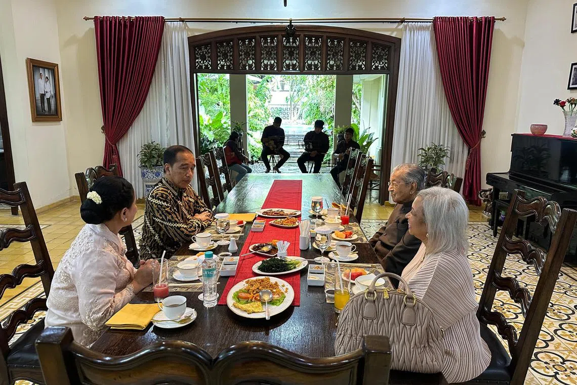 Former Indonesia president Joko Widodo (second from L) and his wife Iriana (L), hosting lunch for former Malaysian prime minister Tun Mahathir Mohamad (second from R) and his daughter Marina (R), at Joko's home on Feb 26, 2025.