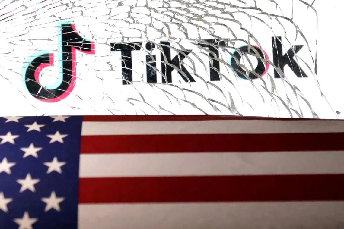 FILE PHOTO: U.S. flag and TikTok logo are seen through broken glass in this illustration taken March 20, 2024. REUTERS/Dado Ruvic/Illustration/File Photo