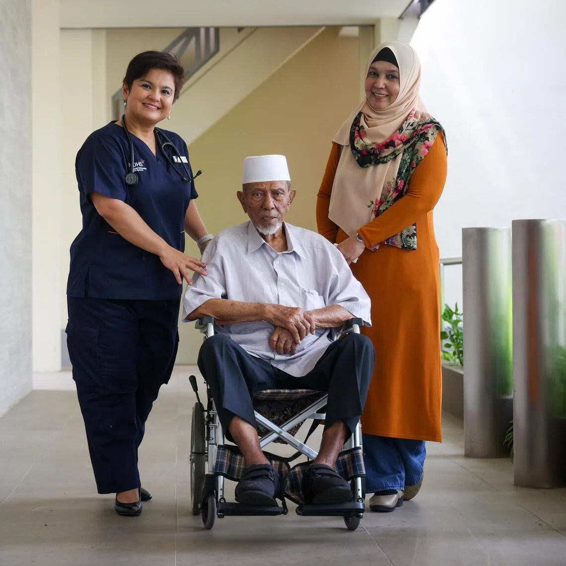 Mr Osman Abdollah with his doctor Neeta Kesu Belani (left) and daughter Hadijah.