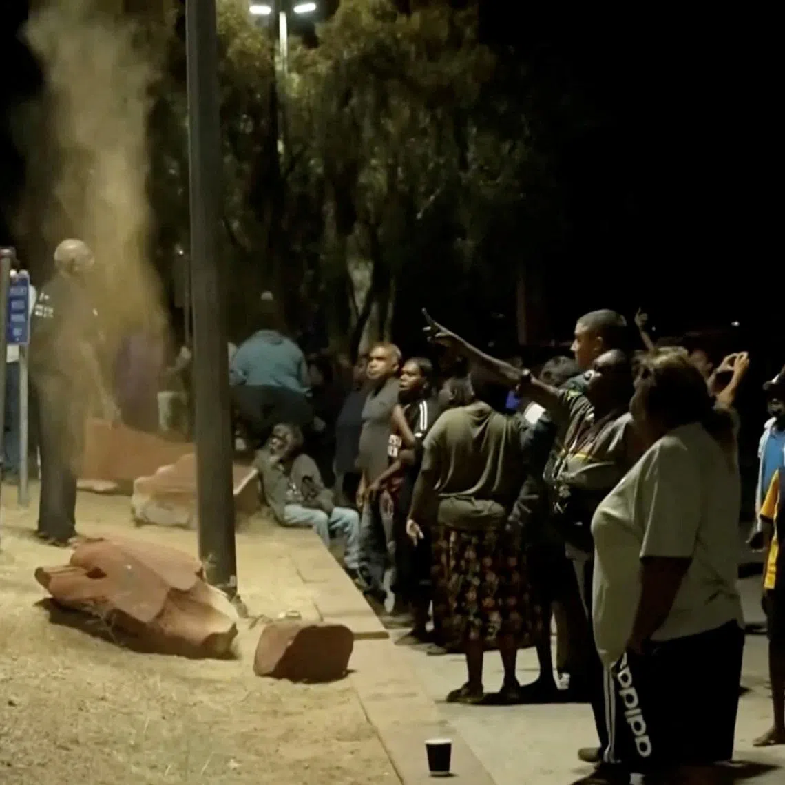 An angry crowd clashed with police as Jefferson Lewis was treated in hospital after his arrest, demanding they hand over the accused child killer so they could punish him themselves.