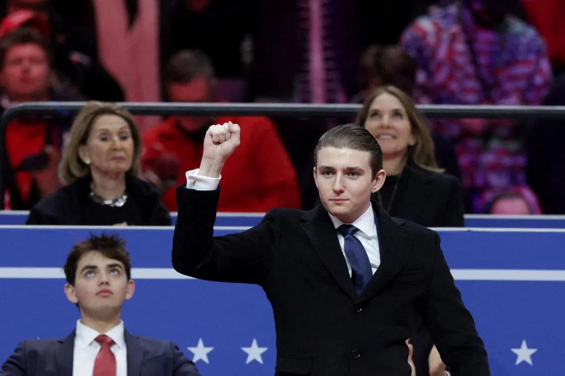 FILE PHOTO: Barron Trump gestures during a rally on the inauguration day of U.S. President Donald Trump's second Presidential term, inside Capital One, in Washington, U.S. January 20, 2025. REUTERS/Mike Segar/File Photo