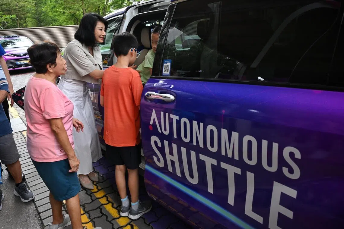 Senior Minister of State for Transport Sun Xueling with residents during the launch of ComfortDelGro’s free driverless shuttle rides in Punggol on June 22.