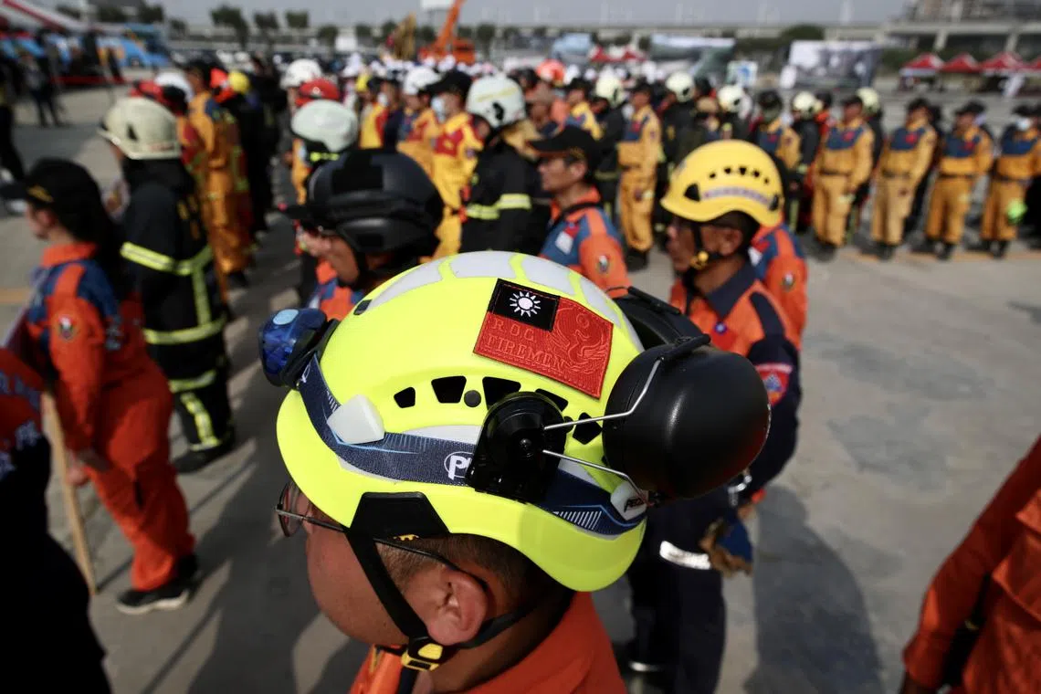Taiwanese rescuers lining up during an emergency response drill in Taichung city, Taiwan, on April 13.