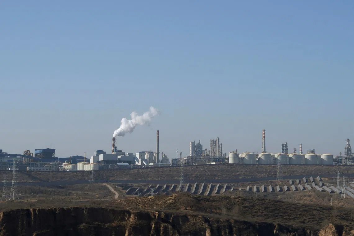 FILE PHOTO: Solar panels lie in front of factories at Jinjie Industrial Park in Shenmu, Shaanxi province, China November 20, 2023. REUTERS/Colleen Howe/File Photo