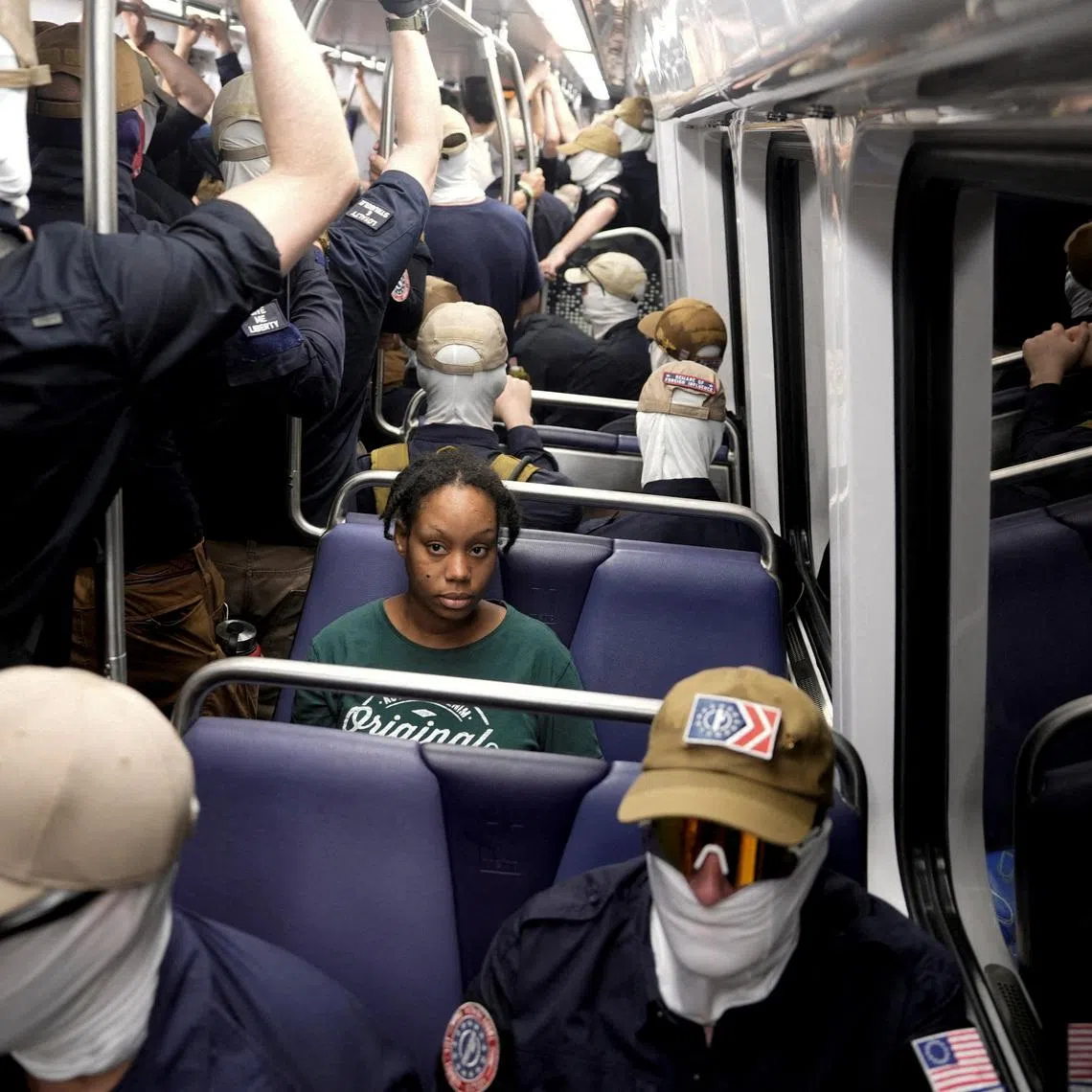 Members of the group Patriot Front ride the metro on the 250th anniversary of U.S. independence in Washington, D.C., U.S., July 4, 2026. REUTERS/Cheney Orr