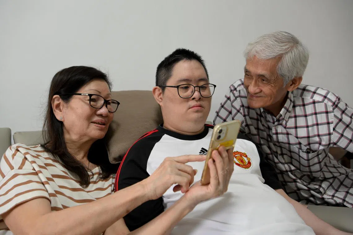 Mr John Koh (centre) with his parents Mr Cheng Chiang Luang and Ms Koh Song Poon.