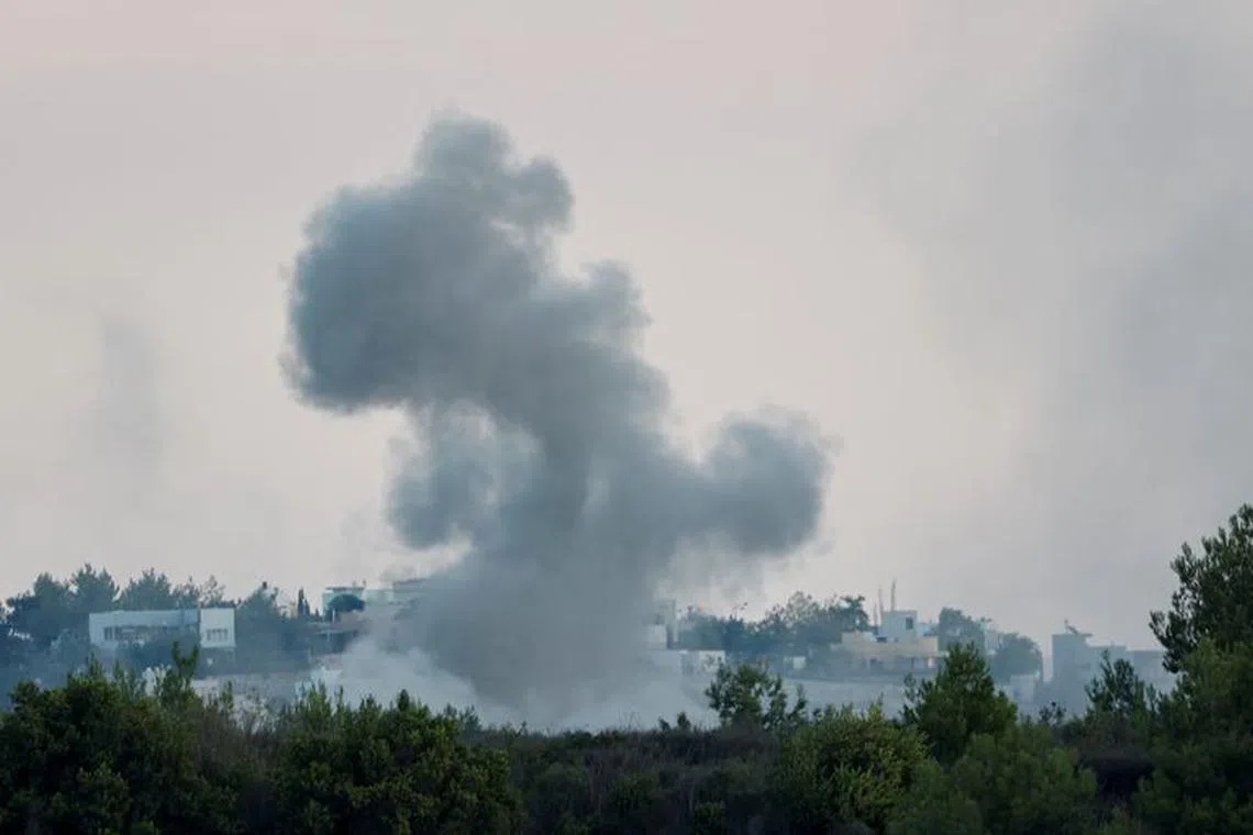 Smoke rises after Israeli shelling , as seen from Lebanese side, near the border with Israel, in Alma Al-Shaab, southern Lebanon, October 13, 2023. REUTERS/Thaier Al-Sudani