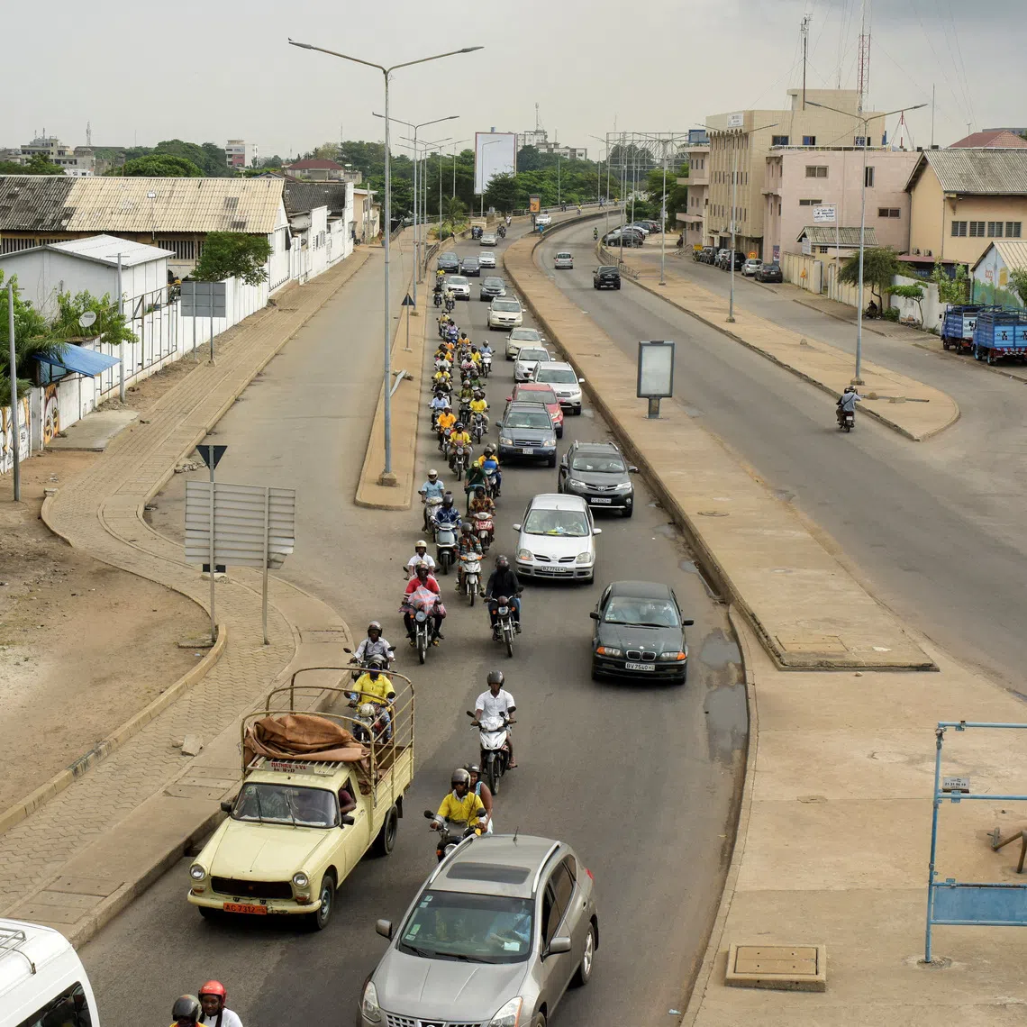 Traffic moves along a road, a day after the country's armed forces thwarted the attempted coup against the government of Benin's President Patrice Talon, in Cotonou, Benin, on December 8, 2025. REUTERS/Charles Placide Tossou