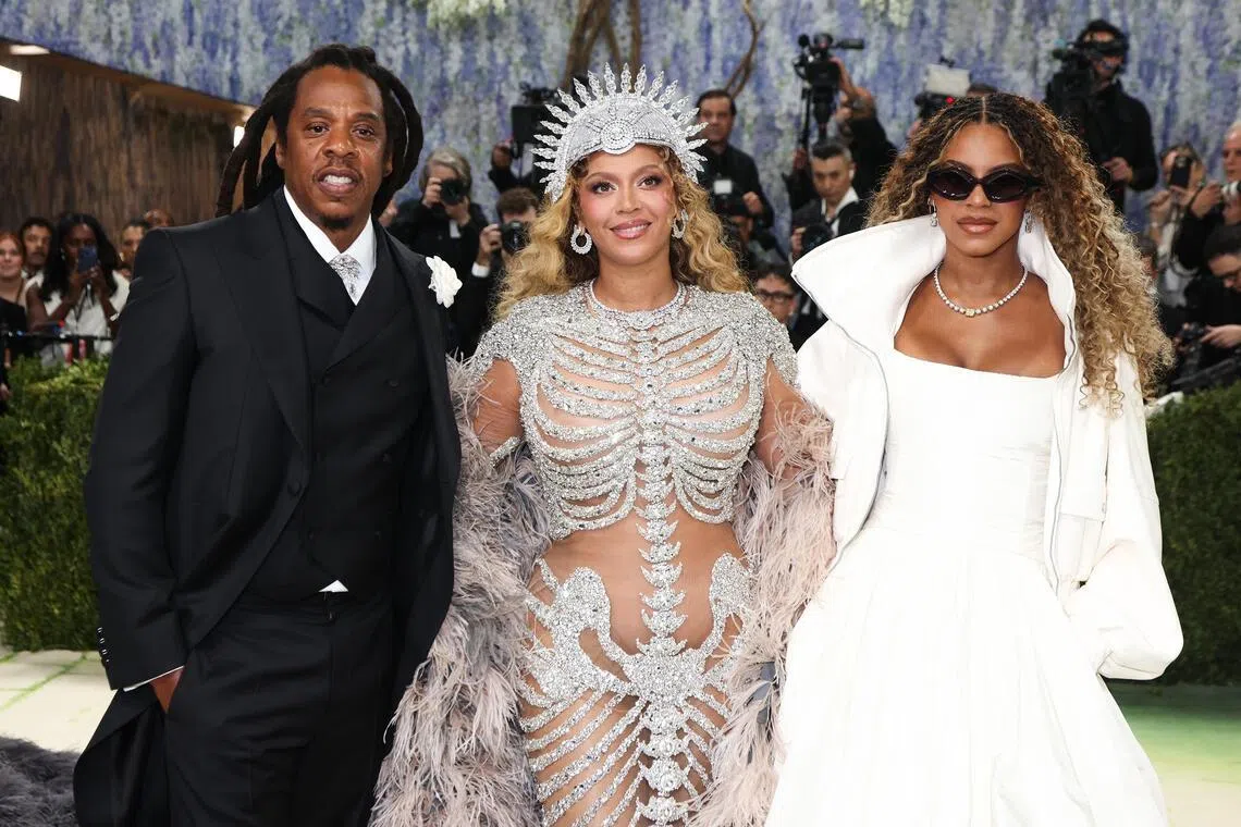 Beyonce (centre) was joined by her rap mogul husband Jay-Z and daughter Blue Ivy on the red carpet for the 2026 Met Gala.