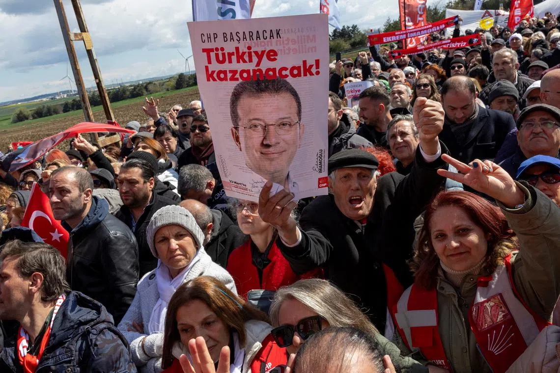 Supporters of Ekrem Imamoglu, the mayor of Istanbul and main rival of President Tayyip Erdogan, protest outside his prison during his first hearing over accusations leveled against him, as Turkish gendarmerie banned them to approach to the Marmara Prison, formerly Silivri Prison, and Courthouse Complex in Istanbul, Turkey, April 11, 2025. REUTERS/Umit Bektas/File Photo